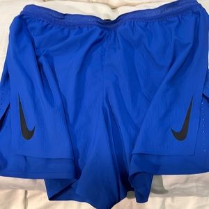 Blue Nike running shorts